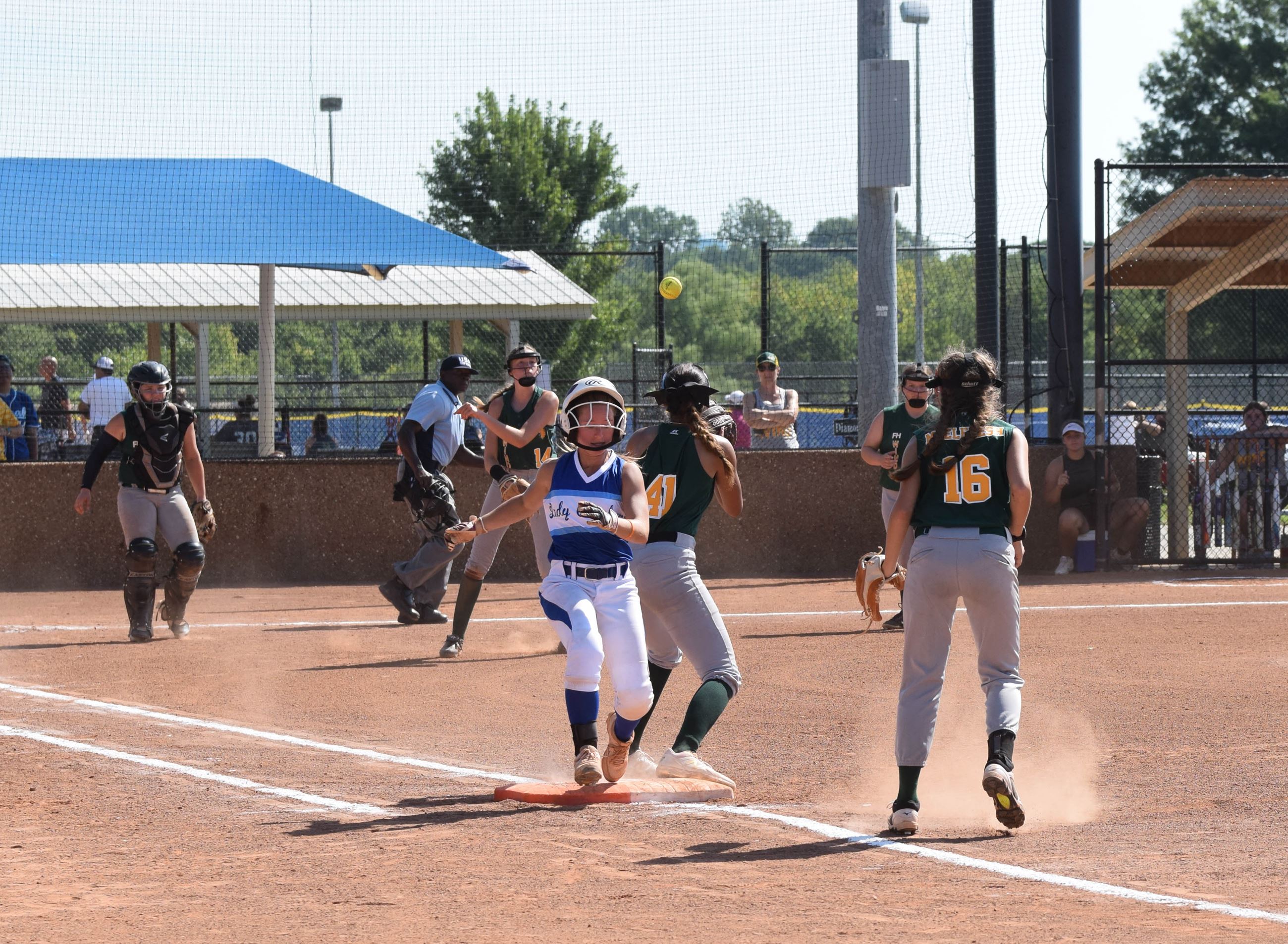 Beating out infield hit in softball game